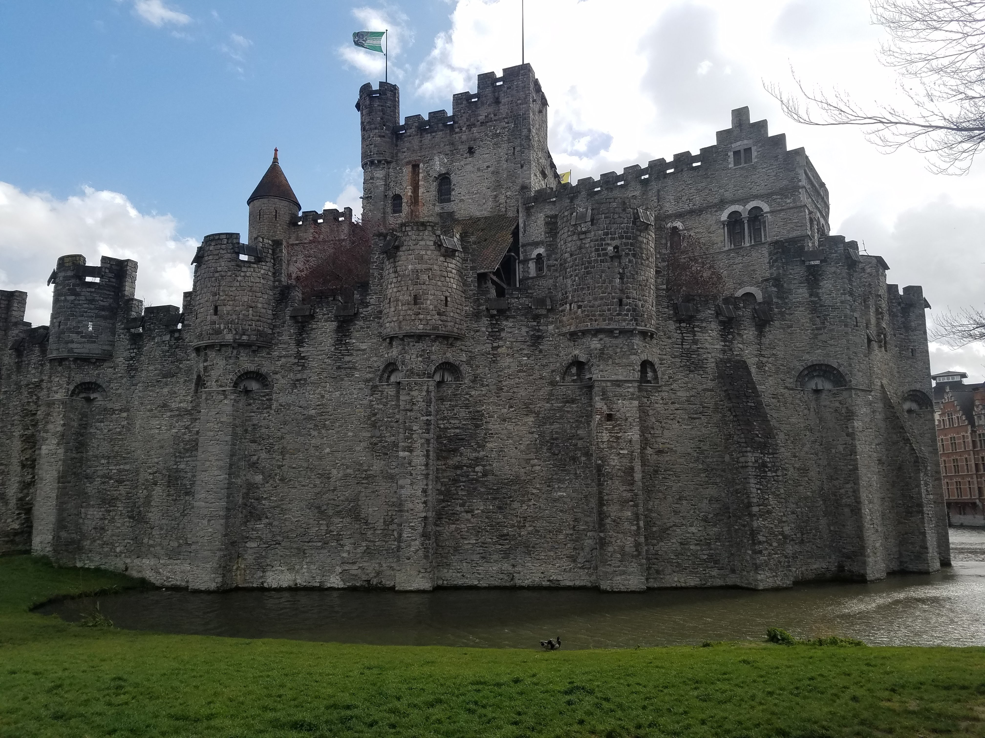 A large stone castle surrounded by a moat