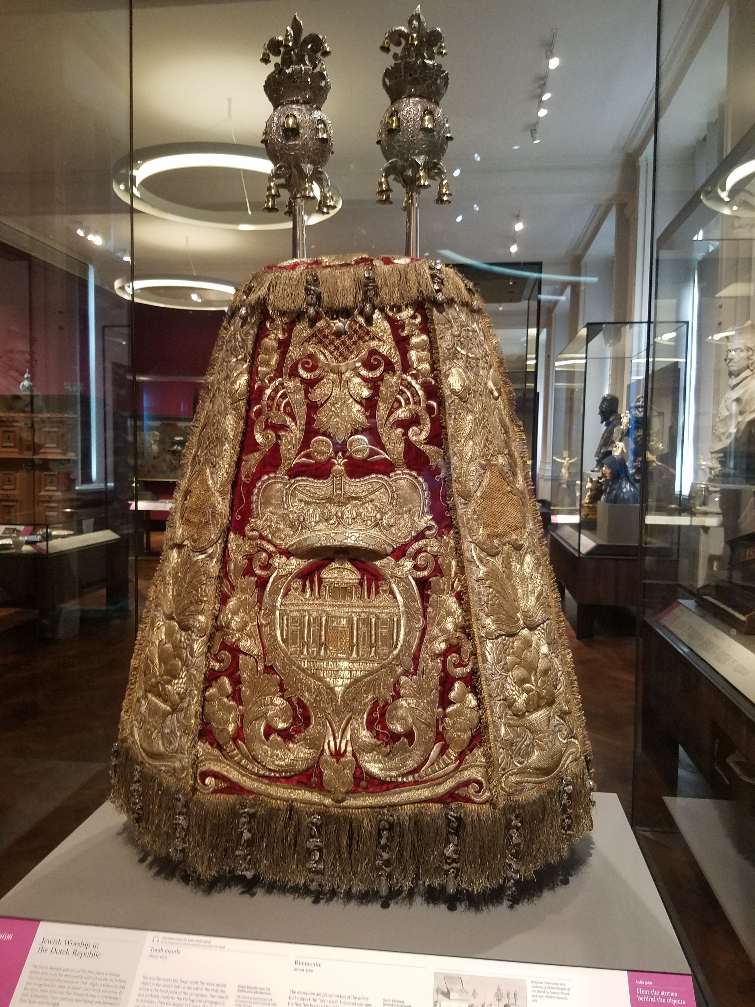A gold covered Torah scroll in an exhibit at the V&A Museum in London