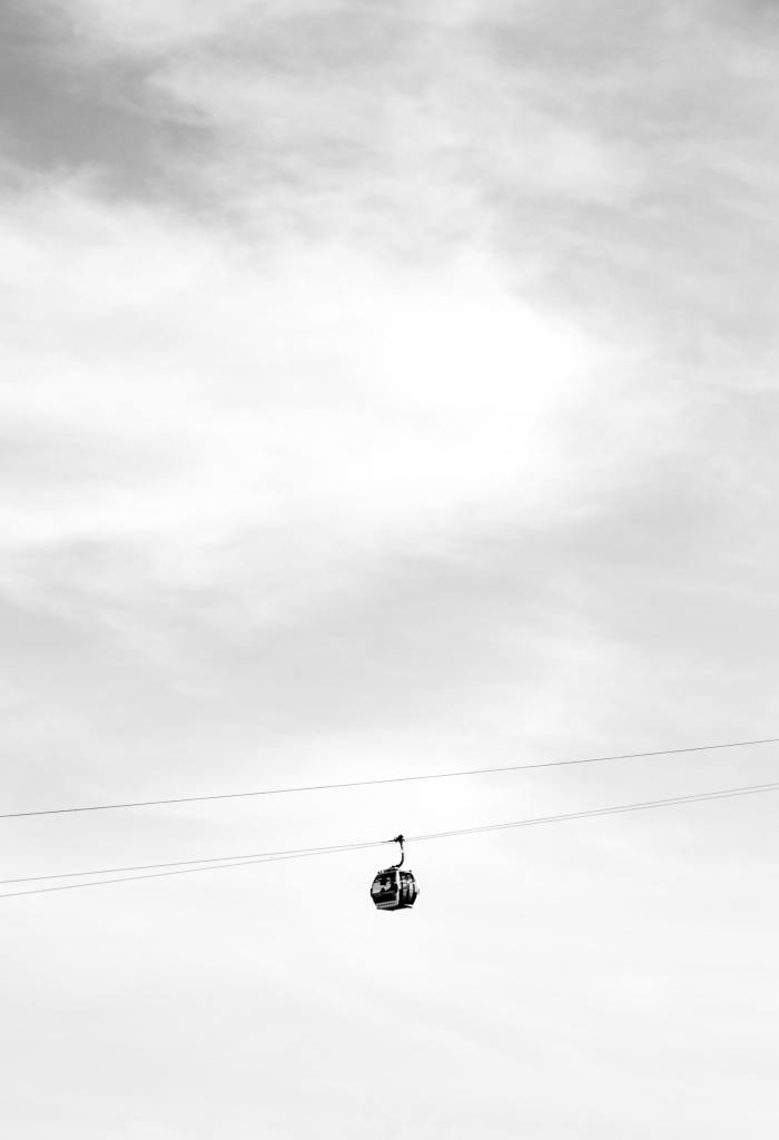 A cable car crosses its line on a very cloudy day