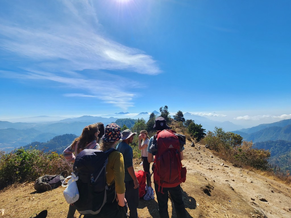 Hikers look out over mountains in Guatemala