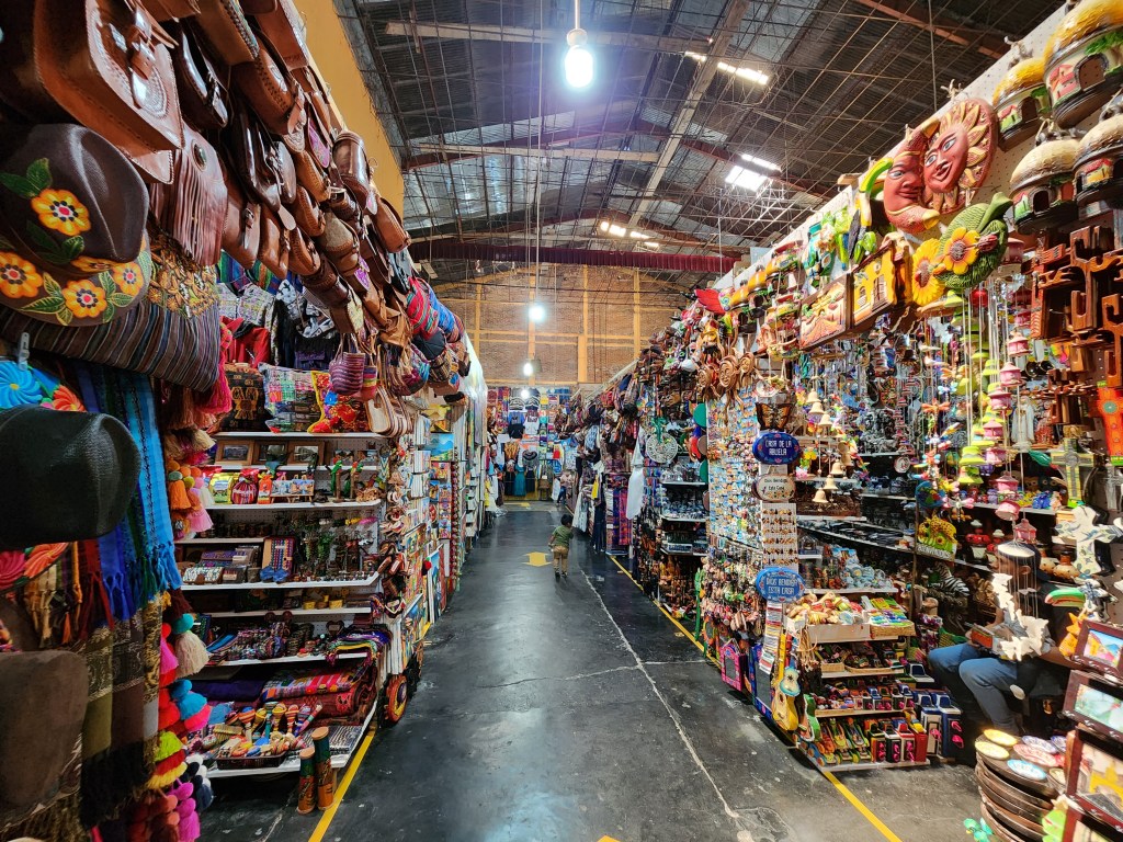 The colourful aisles of a large artisan market in Antigua Guatemala