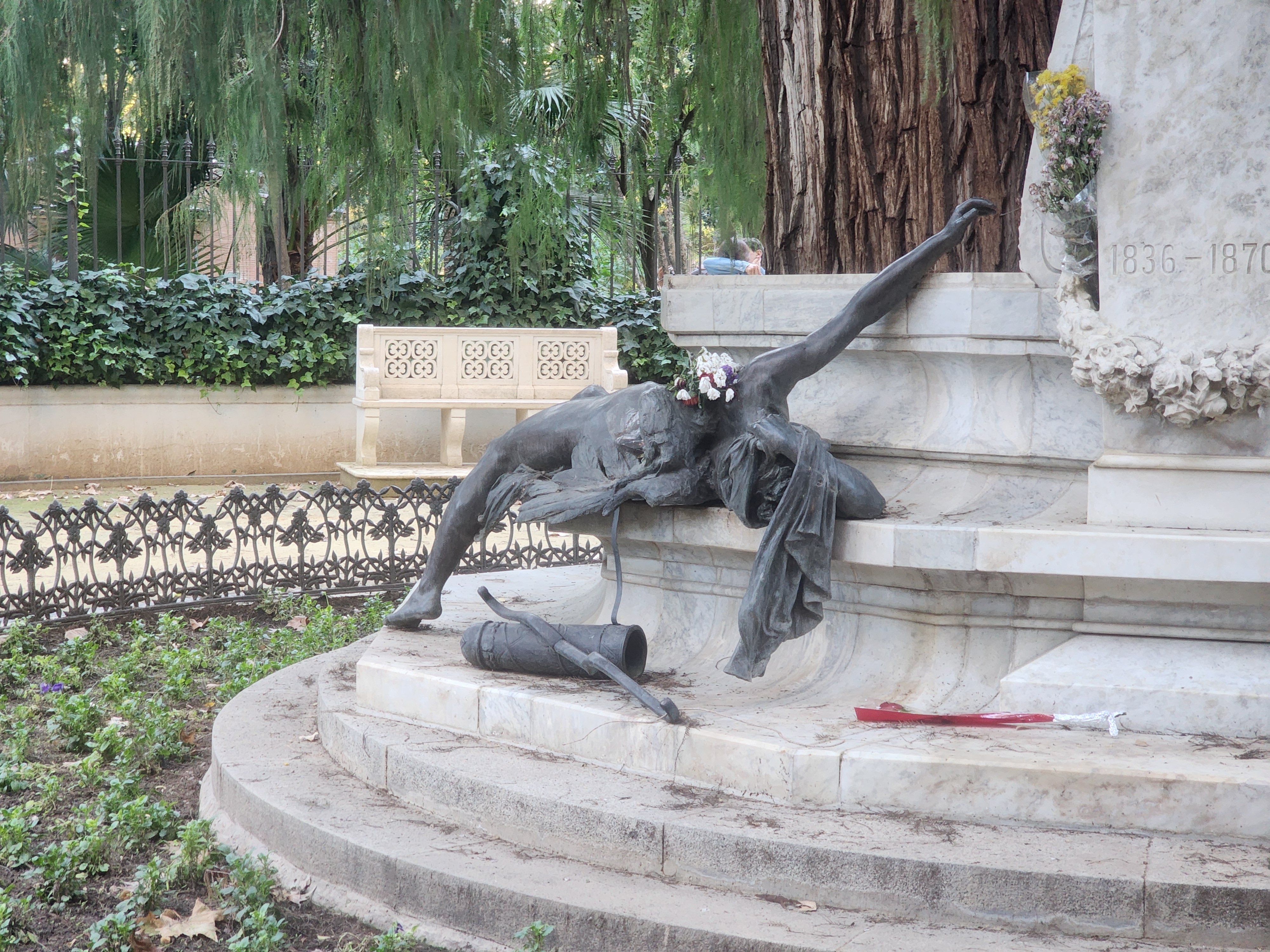 A statue of a fallen angel in Parque de Maria Luisa in Seville