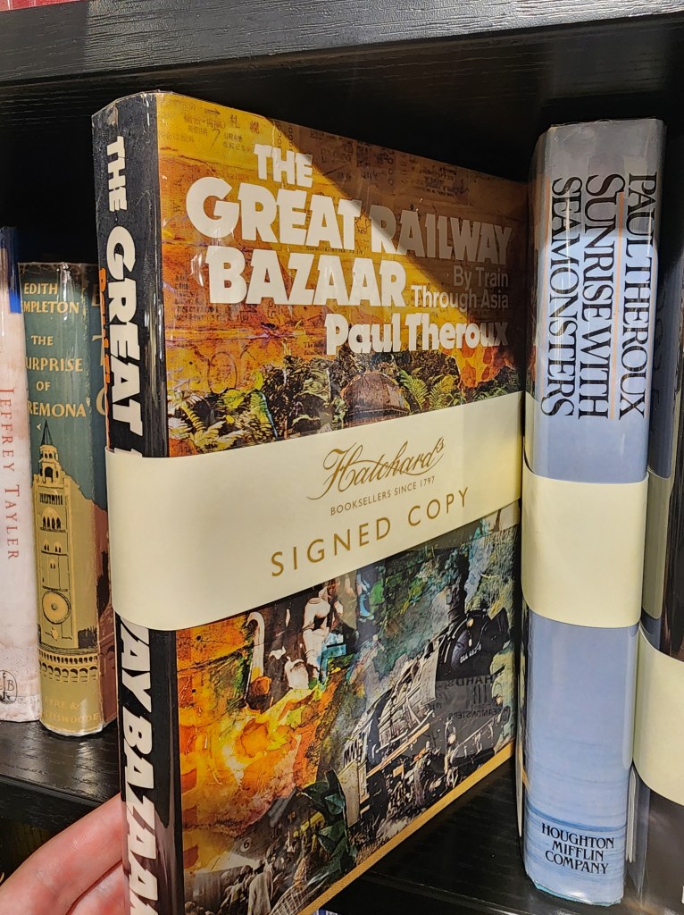 A signed copy of The Great Railway Bazaar by Paul Theroux in a bookshop