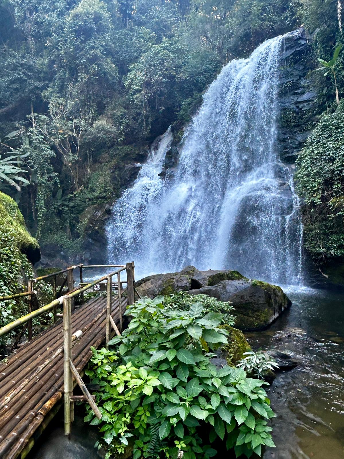 A waterfall crashing in to the lush jungle in Thailand.