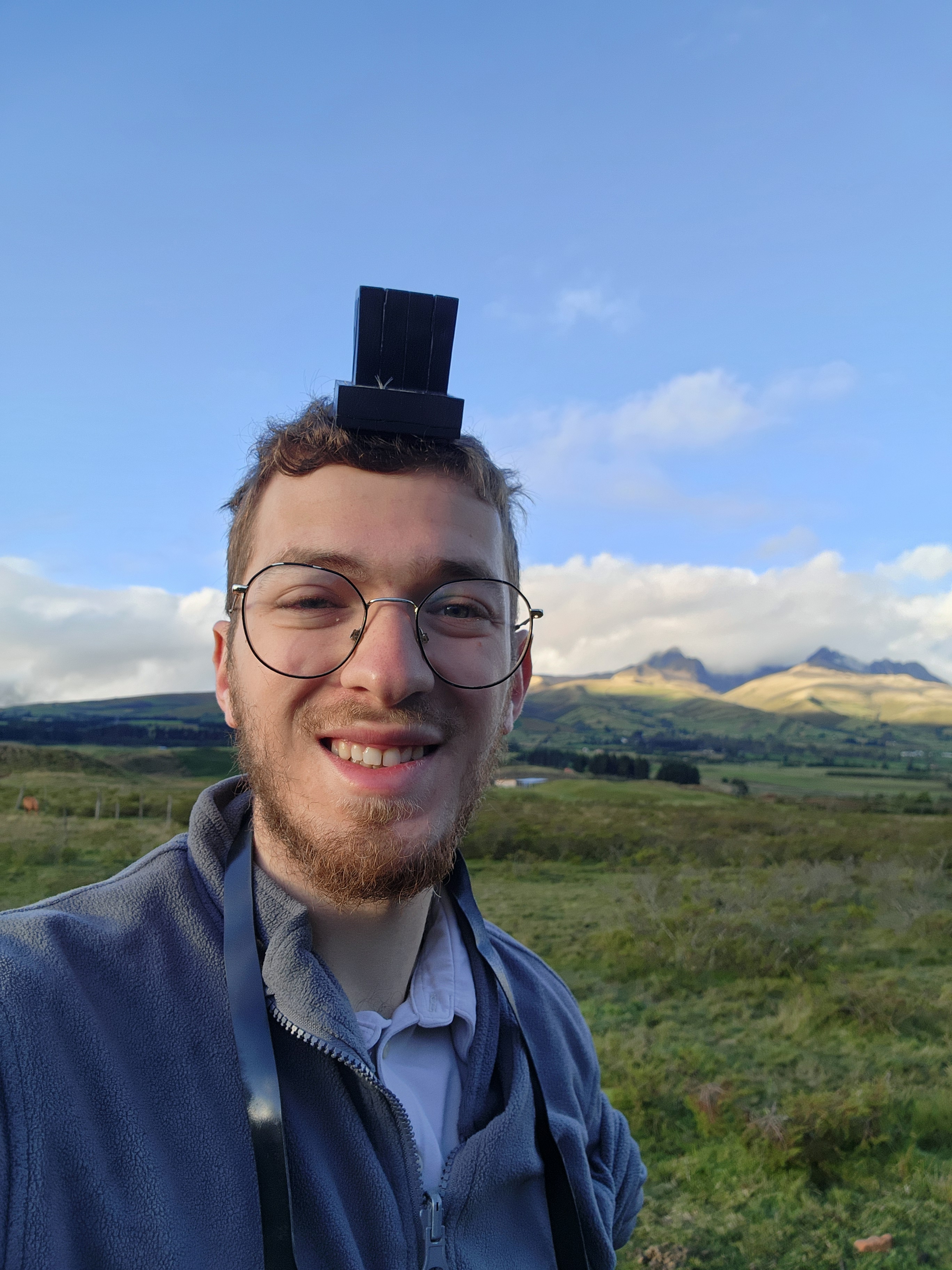 A smiling man wearing Teffilin in Cotopaxi National Park